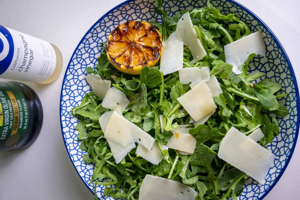 parmesan and lemon arugula salad in a bowl