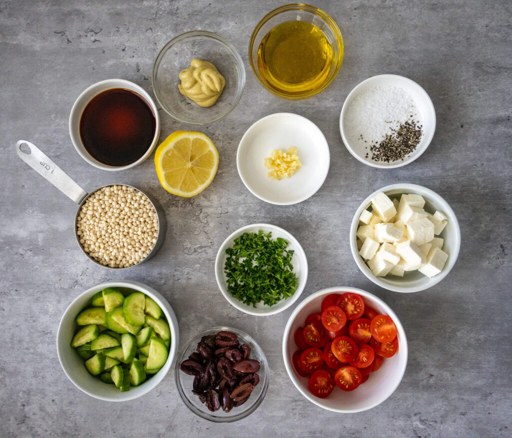 ingredient spread for preparing Mediterranean Couscous Salad with Red Wine Vinaigrette