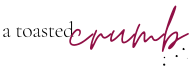 Stylized text logo reads a toasted crumb with a toasted in black and crumb in dark pink cursive.