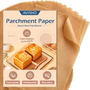 A stack of brown parchment paper sheets sits beneath a branded package labeled AVIRHO Parchment Paper. The packaging highlights features: 9x13, heat-resistant up to 450°F, food grade, unbleached, and non-stick, with images of baked goods.